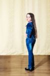 Little Girl With Long Hair In A Blue Denim Suit Stock Photo