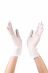 Hand Wearing Surgical Gloves Stock Photo