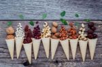 Concept For Homemade Various Nuts Ice Cream. Mixed Nuts In Waffl Stock Photo