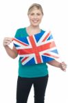 Proud Uk Female Supporter Holding National Flag Stock Photo