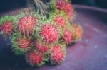 Rambutan On Wood Stock Photo