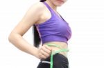 Woman In Sport Bra Measuring Her Body With Tape Isolated On Whit Stock Photo