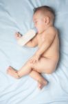 Baby Boy Holding Milk Bottle Stock Photo