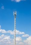 Communication Antenna Repeater Tower On Blue Sky Background Stock Photo