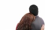 Rear View Of A Loving Couple Standing With Arms Around Stock Photo