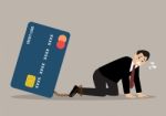 Desperate Businessman With Credit Card Burden Stock Photo