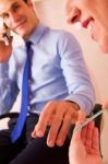 Businessman Receiving Manicure Treatment Stock Photo