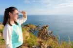 Women Tourists Looking At Beautiful Nature Sea Stock Photo