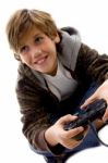 Smiling Boy Playing Joystick Stock Photo