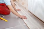 Man Laying Laminate Flooring Stock Photo