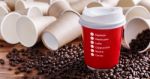 Red Paper Coffee Cup With Coffee Beans Stock Photo