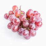 Red Grapes On White Background Stock Photo