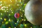 Close Up Big Yellow Glitter Ball Christmas On Tree With Wire White Light Background Stock Photo