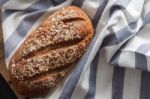 Dark Multigrain Bread Whole Grain Fresh Baked On Rustic Closeup Stock Photo