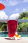 Red Soda Water At Poolside In Summer Sunny Day Stock Photo