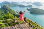 Woman Jumping On Mountain Stock Photo