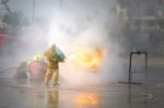 Fireman. Firefighters Fighting Fire During Training Stock Photo