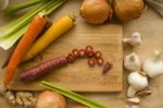 Sliced Carrots Surrounded By Vegetables Stock Photo