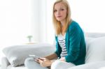 Pretty Young Woman Using Her Digital Tablet At Home Stock Photo