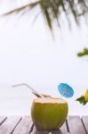 Coconut Water Drink Served In Coconut With Drinking Straw On The Stock Photo