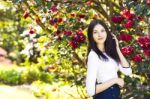 Young Beautiful Woman With Long Straight Dark Hair Posing In Spr Stock Photo