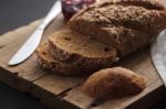 Dark Multigrain Bread Whole Grain And Jam Fresh Baked On Rustic Closeup Stock Photo