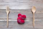 Wooden Spoon Serve With Red Heart On Wood Table Stock Photo