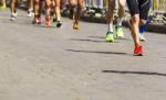 Detail Of A Group Of Runners During A City Marathon Stock Photo