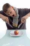 Man Going To Eat Apple With Fork And Knife Stock Photo