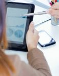 Executive Hands With Digital Tablet In A Financial Meeting Stock Photo