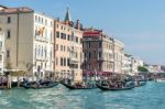 Gondoliers Ferrying People In Venice Stock Photo