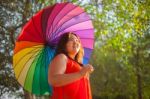 Happy Woman With Umbrella Stock Photo