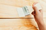 Closeup Hand Use Brush Paint Clear Lacquer On Wood Surface Stock Photo