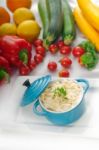 Mac And Cheese On A Blue Little Clay Pot Stock Photo