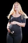 Pregnant Woman Holding Tummy Stock Photo