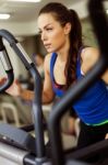 Young Woman Working Out On A Stepper Stock Photo