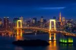 Tokyo Skyline With Rainbow Bridge And Tokyo Tower. Tokyo, Japan Stock Photo