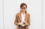 Portrait Of Thai Adult Businesswoman Beautiful Girl Using Her Smart Phone Stock Photo