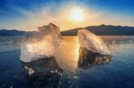 Very Large And Beautiful Chunk Of Ice At Sunrise In Winter Stock Photo