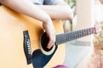 Woman's Hands With Acoustic Guitar In Relax Post Stock Photo