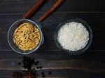 Rice And Paddy In Separated Glasses Stock Photo