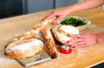 Hand Holding Baguettes And Breads Stock Photo