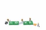 Miniature Worker Team Building Word Love On White Background Stock Photo