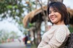 Portrait Asian Woman Sitting On The Bench Stock Photo