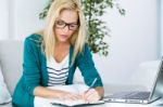 Pretty Young Woman Working With Laptop At Home Stock Photo