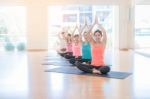 Asian Woman Doing Yoga Indoors Stock Photo