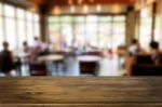 Selected Focus Empty Brown Wooden Table And Coffee Shop Or Resta Stock Photo