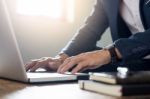 Close Up Of Young Businessman Working Typing On Laptop In Coffee Stock Photo