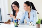 Two Business Woman Working In Office With Computer Stock Photo