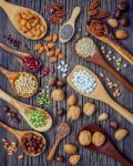 Various Legumes And Different Kinds Of Nutshells In Spoons. Waln Stock Photo